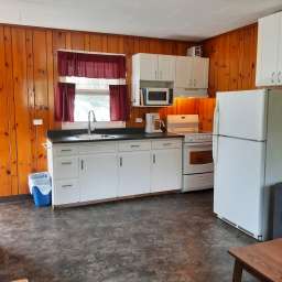 Fully stocked kitchen with 24" range, full fridge and all cooking supplies